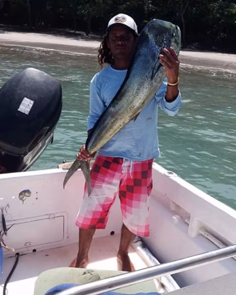 Professional fishing guide demonstrating proper technique for saltwater fishing.